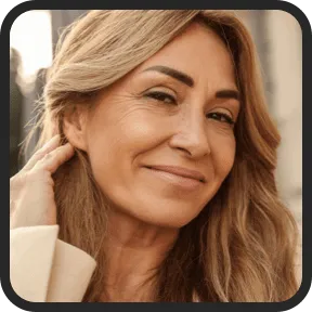 Linda P. smiling with improved hearing